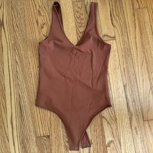 Burnt orange, double lined bodysuit